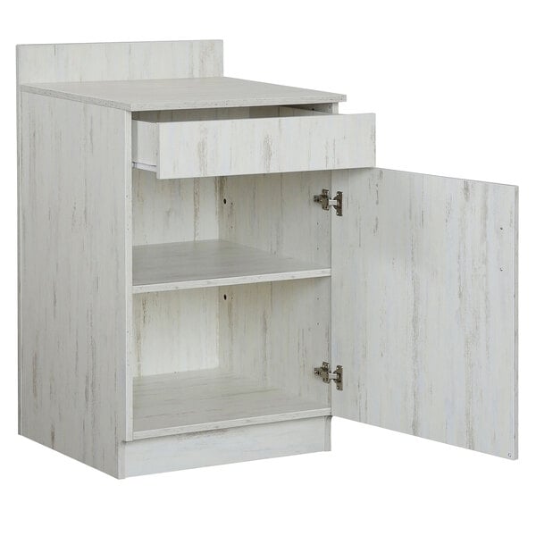 a white cabinet with open shelves