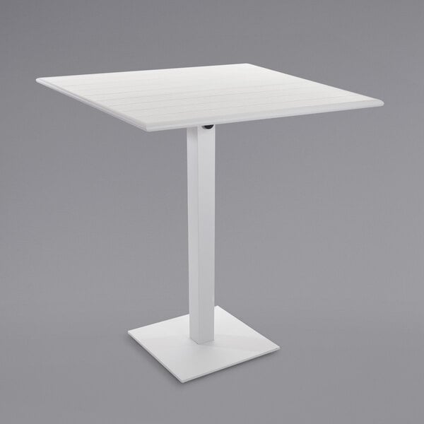 a white square base with a white pole