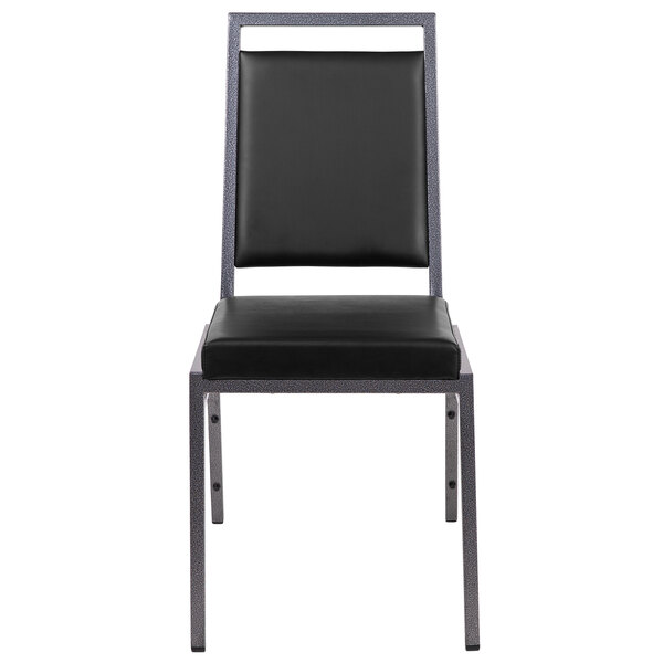 A Flash Furniture black vinyl banquet chair with metal legs.