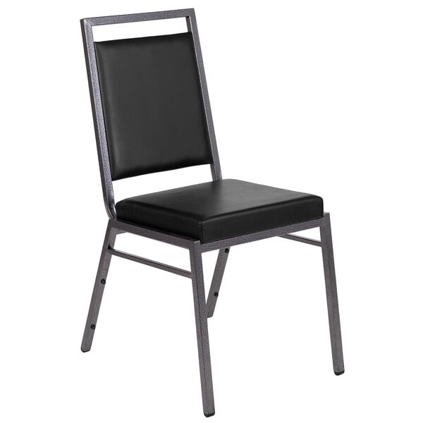 A Flash Furniture black vinyl banquet chair with silver metal legs.