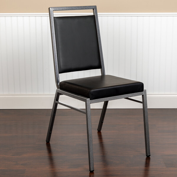 A black Flash Furniture banquet chair with a silver metal frame.