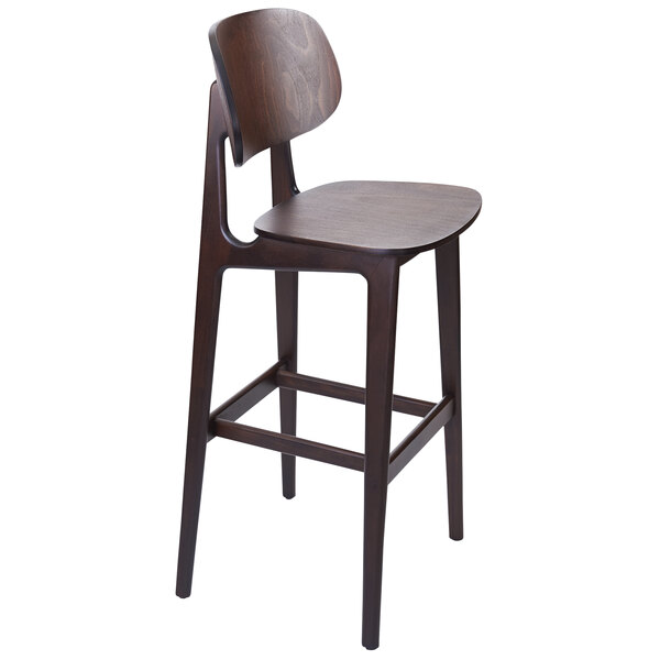 A BFM Seating Emma dark walnut bar height chair with a wooden seat and backrest.