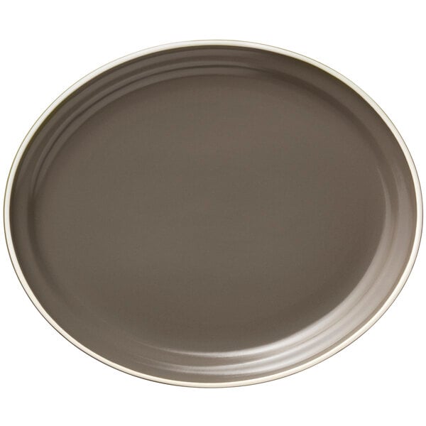 A close-up of a Libbey matte olive oval platter with a white rim.