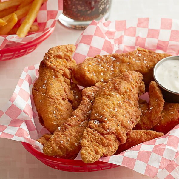 chicken tenders in red basket with side of ranch