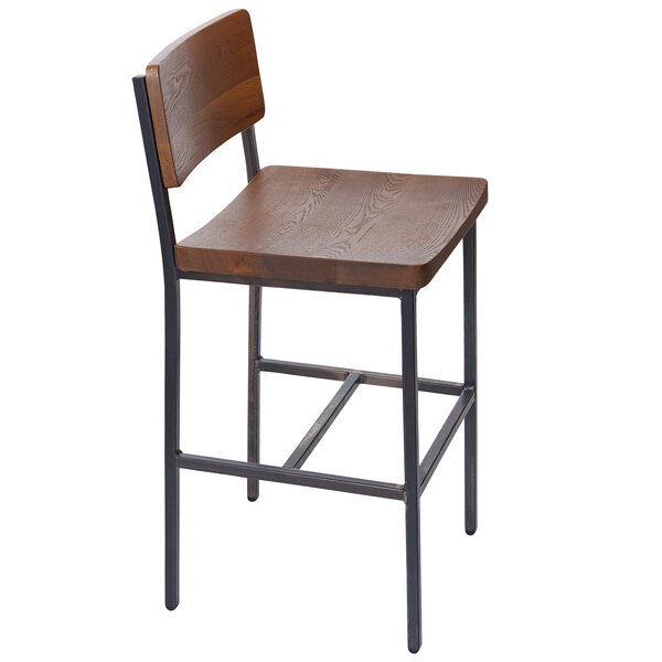 A BFM Seating Memphis counter height stool with a wooden back and seat and metal legs.