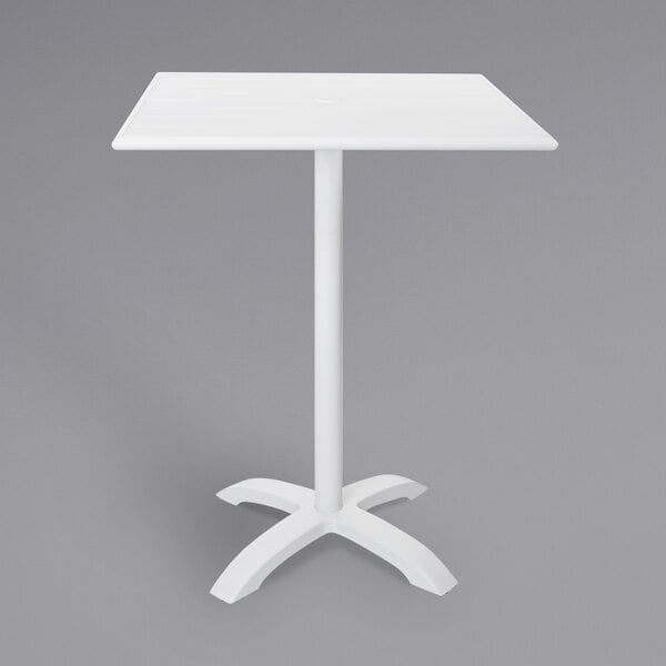 A white square BFM Seating Bali-Beachcomber bar height table with a white metal base.