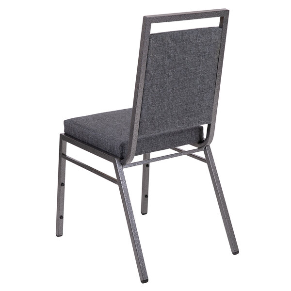 A Flash Furniture dark grey fabric banquet chair with a metal frame and back.