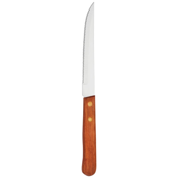 A Walco stainless steel serrated steak knife with a wooden handle.