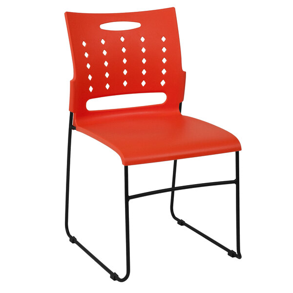 a red chair with black legs