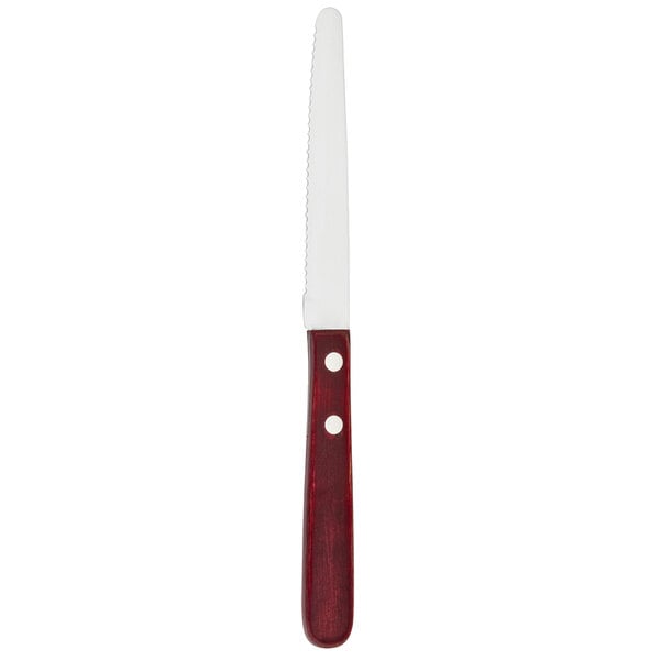 A Walco stainless steel steak knife with a serrated round tip and a red Polywood handle.