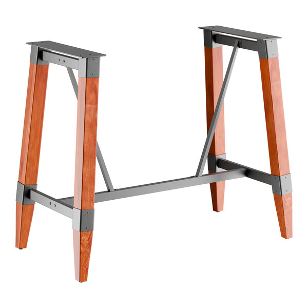 A bar height trestle table base with a rustic mahogany finish and metal supports, designed for 30" x 60" table tops.