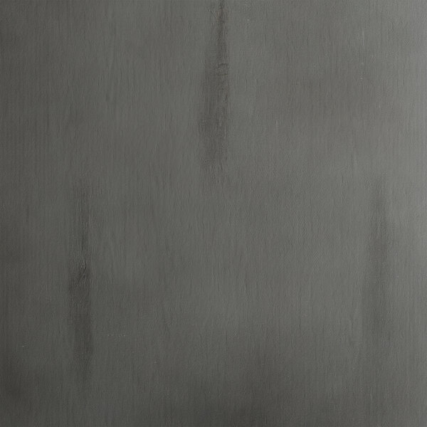 A Lancaster Table & Seating Industrial bar stool with a slate gray finish on a gray surface with a black stripe.