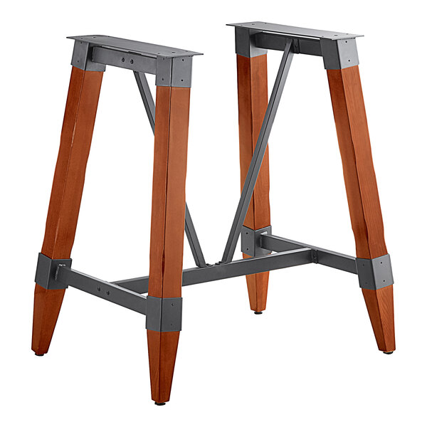 Lancaster Table & Seating bar height trestle table base with wooden legs and metal supports.