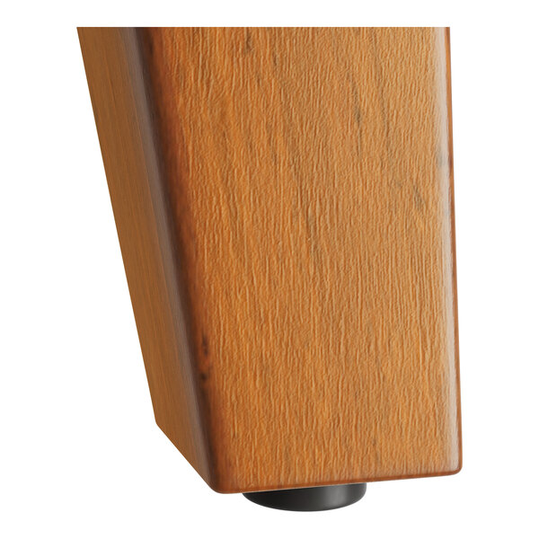 The Lancaster Table & Seating walnut trestle table base for a bar height table with wood legs.