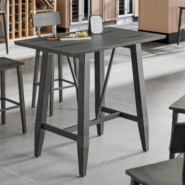 A slate gray industrial-style bar height trestle table base designed for 30" x 48" table tops.