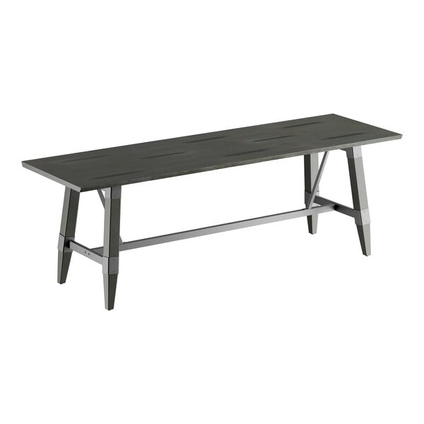 A rectangular solid wood live edge table with a slate gray finish and a trestle base.