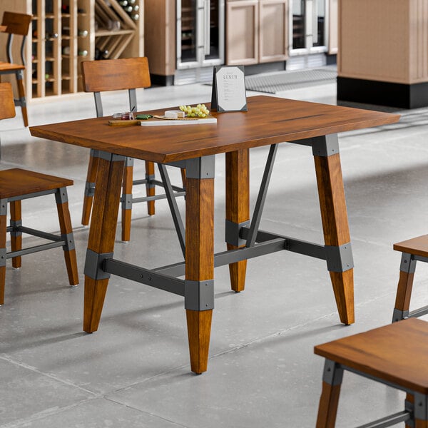 Lancaster Table & Seating Industrial 30" x 48" Solid Wood Live Edge Standard Height Trestle Base Table with Rustic Walnut Finish