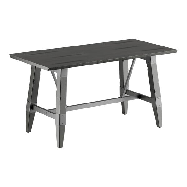 A Lancaster Table & Seating solid wood table with a slate gray finish and trestle base.