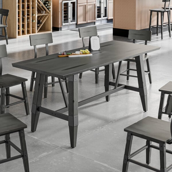A Lancaster Table & Seating live edge table with chairs.