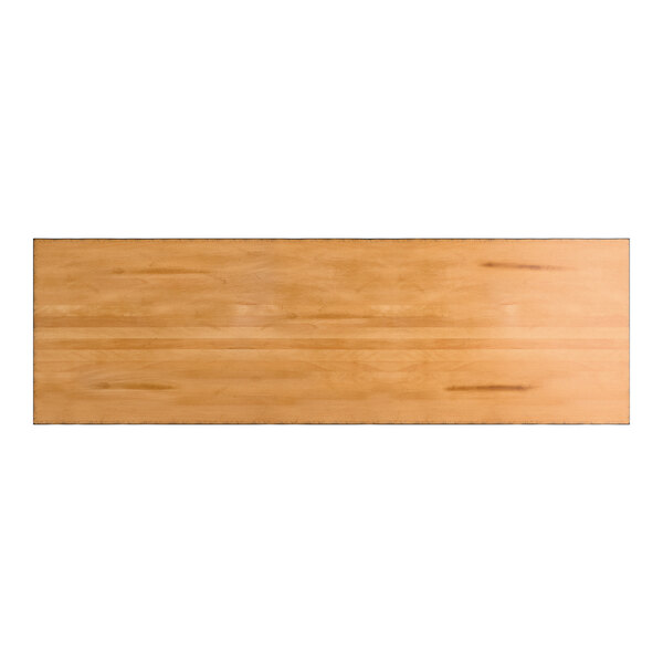 A rectangular wooden surface with a honey maple finish and visible wood grain patterns.
