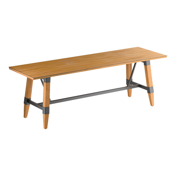 A rectangular wooden table with a honey maple finish, featuring angled legs and metal supports connecting the legs.