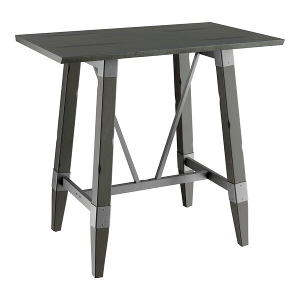 A Lancaster Table & Seating bar height table with a wooden live edge top and slate gray metal trestle base.