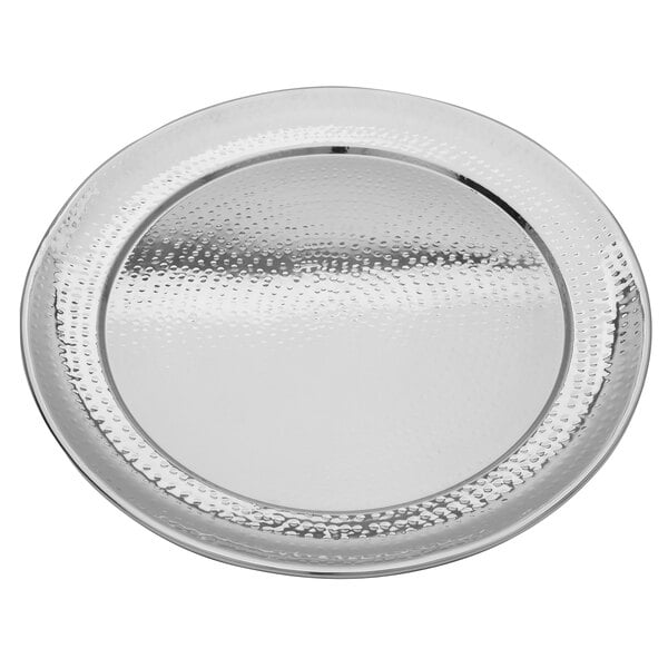 A Walco stainless steel round serving tray with a textured surface.