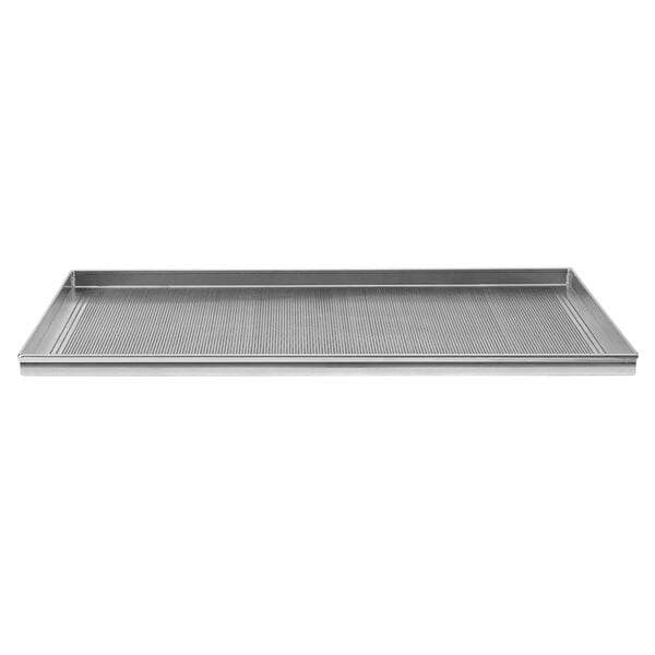 An Axis perforated aluminum tray on a metal surface.