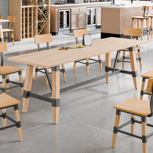 A Lancaster Table & Seating live edge wood table with chairs.