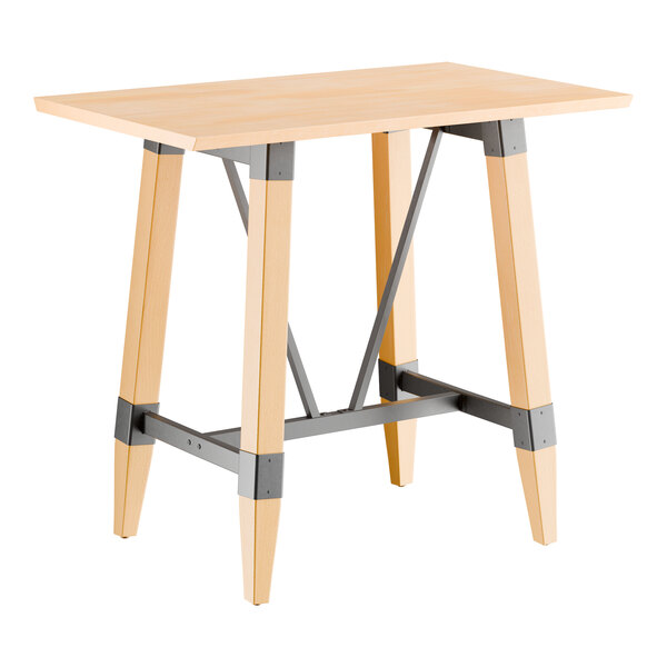 A rectangular bar height table with a solid wood live edge top and trestle base in a bleached oak finish, featuring metal supports.