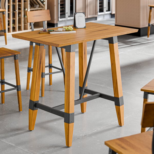 Lancaster Table & Seating Industrial 30" x 48" Solid Wood Live Edge Bar Height Trestle Base Table with Honey Maple Finish