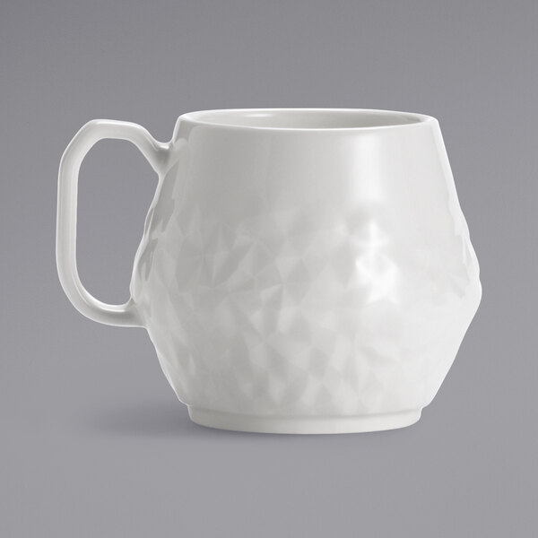 A white mug with a handle.