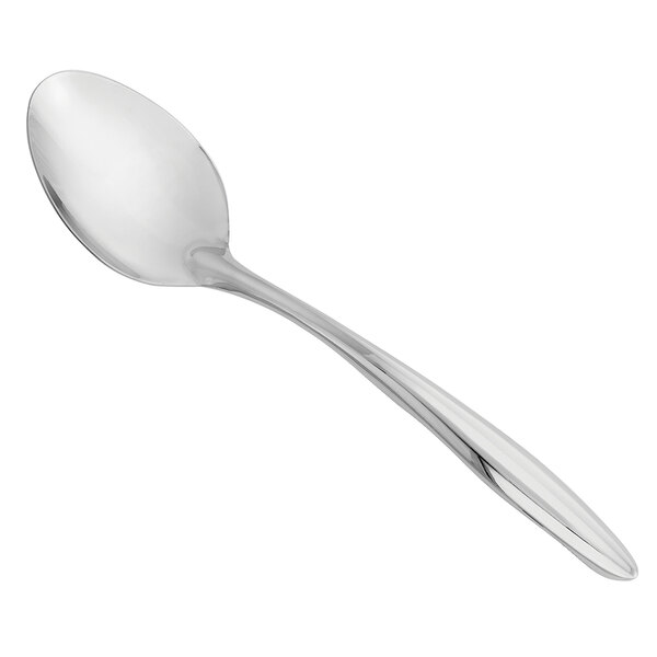 A close-up of a Walco stainless steel solid serving spoon with a long handle.