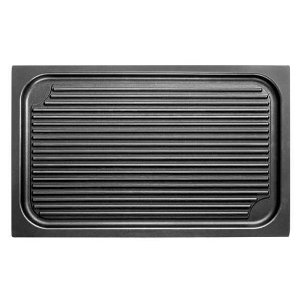 A black rectangular griddle grid with lines on it.