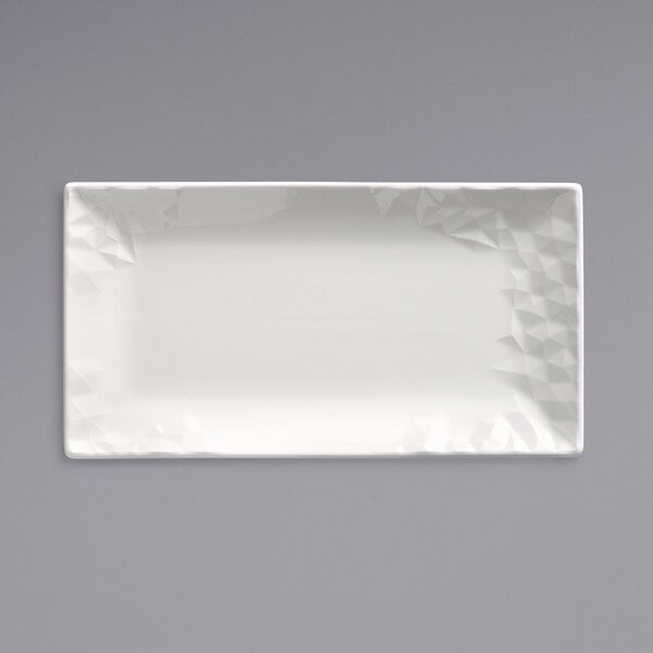 A white rectangular Reserve by Libbey Royal Rideau platter with a triangular pattern.