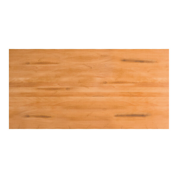 A rectangular solid wood bar height table top with a honey maple finish and live edge design.