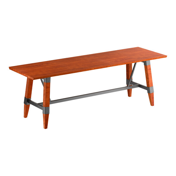 A rectangular wooden table with a reddish-brown finish, angled legs, and gray metal supports connecting the legs.