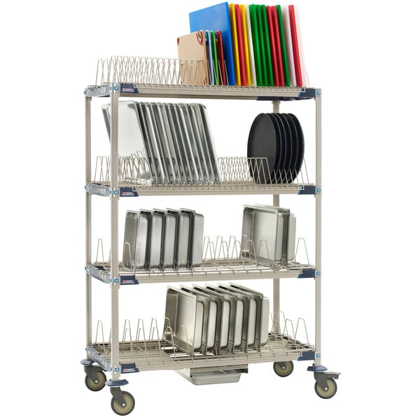 A MetroMax i metal rack with trays and plates on it.