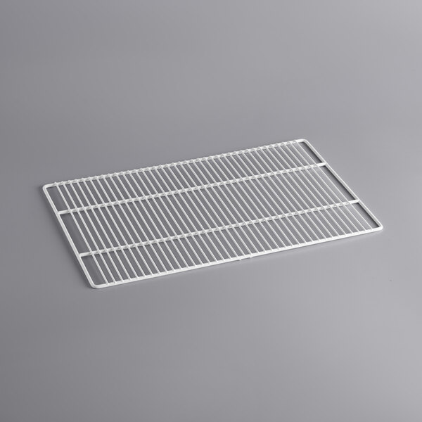 A white metal grid shelf for an Avantco deli case.