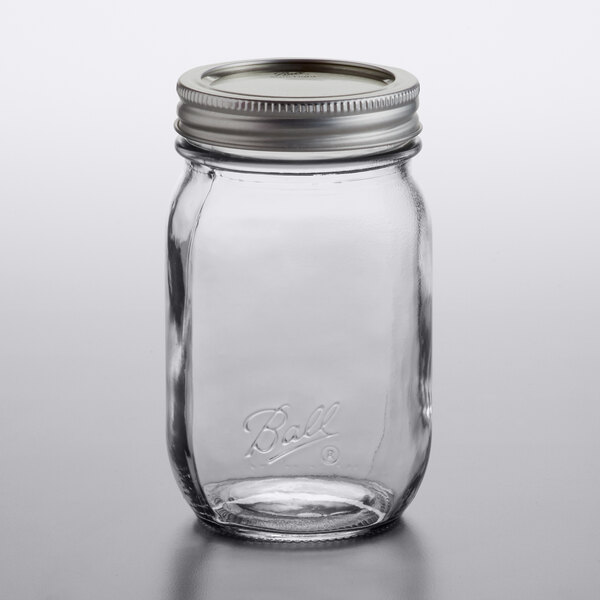 A Ball glass canning jar with a silver metal lid.