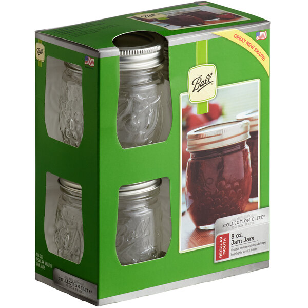A box of Ball glass canning jars with silver lids and bands.