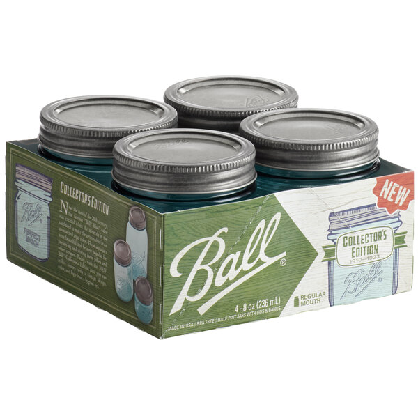 A box of Ball Aqua Vintage Regular Mouth glass canning jars with silver metal lids.