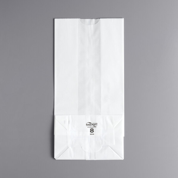 A white paper bag with black text that says "8 lb."