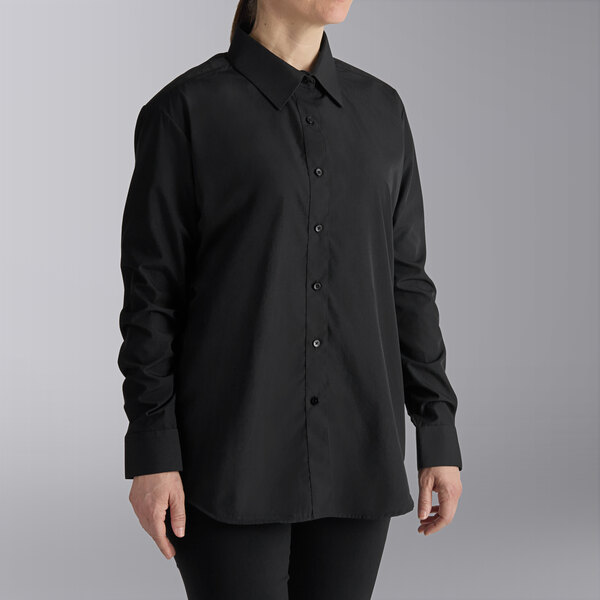 A woman wearing a Henry Segal black long sleeve dress shirt.