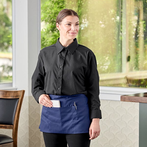 A woman wearing a black Henry Segal long sleeve dress shirt.