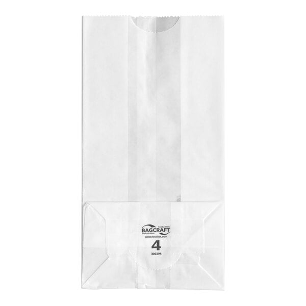 A white paper bag with a flat bottom and printed text near the base.