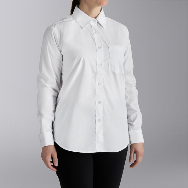A woman wearing a Henry Segal white dress shirt.