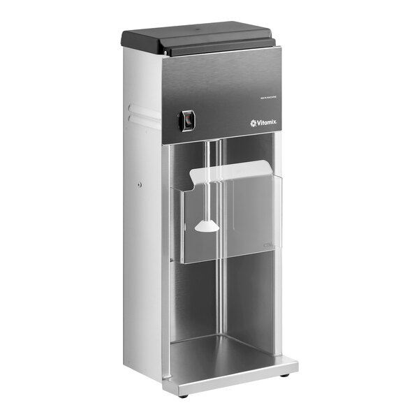 A stainless steel Vitamix countertop frozen dessert mixer with a clear front shield and a cone-shaped agitator.