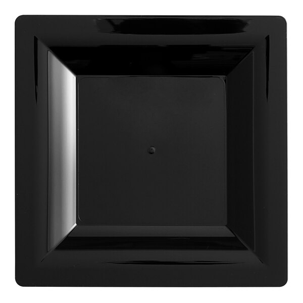 A black square plastic dessert plate with a square shape in the center.