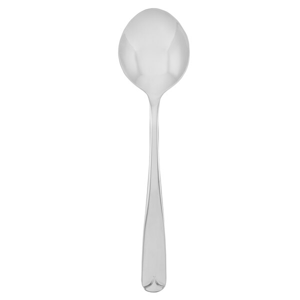 A silver Walco Olde Towne bouillon spoon with a handle.